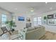 Bright living room featuring coastal decor, a wet bar, recessed lighting and wood planked ceilings at 221 E Mariners Cay # 221, Folly Beach, SC 29439