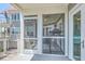 Charming screened-in patio with convenient access to both the main house and outdoor grilling area at 221 E Mariners Cay # 221, Folly Beach, SC 29439