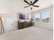 Large bonus room with plenty of space for entertaining, including a ceiling fan and large TV at 226 Midtown Ave, Summerville, SC 29486