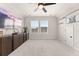 Large bonus room with plenty of space for entertaining, including a ceiling fan and large TV at 226 Midtown Ave, Summerville, SC 29486