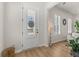 Bright foyer with natural light, wood flooring, and a stylish front door with sidelights at 226 Midtown Ave, Summerville, SC 29486