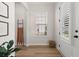 Inviting foyer featuring wood floors, a window for natural light, and stylish decor at 226 Midtown Ave, Summerville, SC 29486