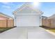 Detached two car garage with wide driveway and light blue siding at 226 Midtown Ave, Summerville, SC 29486