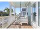 Inviting porch with a swing, chairs, and a view of the neighborhood at 226 Midtown Ave, Summerville, SC 29486