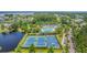 Overhead view of community amenities including pool, tennis courts, and scenic pond at 2269 Hartfords Bluff Cir, Mount Pleasant, SC 29466