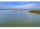 Expansive view of waterway, showcasing the marshy shoreline and distant horizon at 2269 Hartfords Bluff Cir, Mount Pleasant, SC 29466