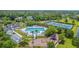 Aerial view of the community pool, tennis courts, and playground, perfect for Gathering fun and recreation at 2269 Hartfords Bluff Cir, Mount Pleasant, SC 29466