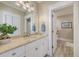 Bathroom featuring vanity with marble countertop, modern fixtures, and an accessible doorway to the water closet at 2269 Hartfords Bluff Cir, Mount Pleasant, SC 29466
