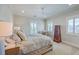 Cozy primary bedroom featuring a ceiling fan, bright windows with shutters, and a chest of drawers at 2269 Hartfords Bluff Cir, Mount Pleasant, SC 29466