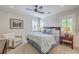 Spacious bedroom with ceiling fan and seating at 2269 Hartfords Bluff Cir, Mount Pleasant, SC 29466