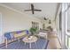 Spacious covered porch with seating and ceiling fans, perfect for outdoor relaxation at 2269 Hartfords Bluff Cir, Mount Pleasant, SC 29466