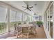 Inviting covered porch with ceiling fans and outdoor dining, ideal for entertaining at 2269 Hartfords Bluff Cir, Mount Pleasant, SC 29466