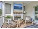 Cozy covered porch with a fireplace, perfect for enjoying the outdoors at 2269 Hartfords Bluff Cir, Mount Pleasant, SC 29466