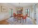 Bright dining room featuring hardwood floors, stylish furniture and French doors at 2269 Hartfords Bluff Cir, Mount Pleasant, SC 29466