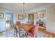 Charming dining area with hardwood floors, decorative lighting and stylish furnishings at 2269 Hartfords Bluff Cir, Mount Pleasant, SC 29466