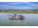 Aerial view of a waterfront property with a boat dock featuring multiple boat lifts and slips, offering convenient water access at 2269 Hartfords Bluff Cir, Mount Pleasant, SC 29466