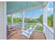 Relaxing front porch featuring a swing, comfortable seating, and scenic neighborhood views at 2269 Hartfords Bluff Cir, Mount Pleasant, SC 29466