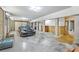 Spacious garage with a black car parked in the center, ample storage, and an open layout at 2269 Hartfords Bluff Cir, Mount Pleasant, SC 29466