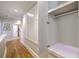 Hallway with hardwood floors and access to closet at 2269 Hartfords Bluff Cir, Mount Pleasant, SC 29466