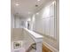 Hallway featuring built in cabinets and hardwood floors at 2269 Hartfords Bluff Cir, Mount Pleasant, SC 29466