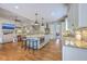 Open-concept kitchen featuring an island, modern appliances, and seamless transition to the living room at 2269 Hartfords Bluff Cir, Mount Pleasant, SC 29466