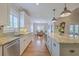 Modern kitchen with white cabinets, granite counters, stainless steel appliances, and view to the dining room at 2269 Hartfords Bluff Cir, Mount Pleasant, SC 29466