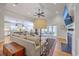Cozy living room featuring a fireplace and an open layout with a view into the modern kitchen at 2269 Hartfords Bluff Cir, Mount Pleasant, SC 29466