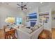 Bright living room featuring a fireplace, built-in bookshelves, and a comfortable sectional sofa at 2269 Hartfords Bluff Cir, Mount Pleasant, SC 29466