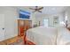 Spacious main bedroom features a ceiling fan and ample storage in dark wood furniture at 2269 Hartfords Bluff Cir, Mount Pleasant, SC 29466