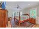 The main bedroom features a four-poster bed, ceiling fan, and access to a private balcony at 2269 Hartfords Bluff Cir, Mount Pleasant, SC 29466