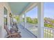 Picturesque outdoor porch featuring multiple chairs and an eye-catching neighborhood view at 2269 Hartfords Bluff Cir, Mount Pleasant, SC 29466