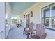 Inviting porch with blue ceiling and outdoor seating, perfect for relaxing and enjoying neighborhood views at 2269 Hartfords Bluff Cir, Mount Pleasant, SC 29466