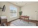 Bright bedroom featuring hardwood floors, a desk, and ample natural light, perfect for a home office at 243 Old Savannah Dr, Goose Creek, SC 29445