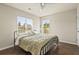 Comfortable bedroom with two windows, hardwood floors, and a ceiling fan at 243 Old Savannah Dr, Goose Creek, SC 29445