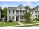 Charming two-story home with double porches and well-manicured lawn at 243 Old Savannah Dr, Goose Creek, SC 29445