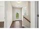 Bright hallway with hardwood floors and a glass door leading to the outside at 243 Old Savannah Dr, Goose Creek, SC 29445