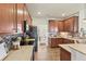 Kitchen with beautiful cabinets, stone countertops, tile backsplash, and modern appliances at 243 Old Savannah Dr, Goose Creek, SC 29445