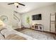 Inviting living room with cozy seating, fireplace, and stairs to the next level at 243 Old Savannah Dr, Goose Creek, SC 29445