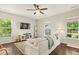 Cozy living room with hardwood floors, a comfortable white sofa, and plenty of natural light at 243 Old Savannah Dr, Goose Creek, SC 29445