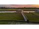 Aerial view of a private dock with boat lift, surrounded by marsh grasses and water inlet at 27 Rebellion Rd, Charleston, SC 29407