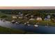 Beautiful aerial view of luxurious waterfront homes with docks and boat lifts along river at 27 Rebellion Rd, Charleston, SC 29407