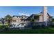 Backyard view showcasing a private pool and outdoor seating in a lushly landscaped setting at 27 Rebellion Rd, Charleston, SC 29407