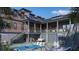 Stunning backyard with a private pool, lounge chairs, and well-maintained landscaping at 27 Rebellion Rd, Charleston, SC 29407