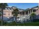 Beautiful backyard with a pool, seating areas, lush greenery, and charming home exterior at 27 Rebellion Rd, Charleston, SC 29407