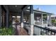 Inviting outdoor balcony with comfortable seating, a grill, and beautiful architectural details at 27 Rebellion Rd, Charleston, SC 29407