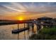 Waterfront view featuring a boat lift and covered gazebo, perfect for relaxation at 27 Rebellion Rd, Charleston, SC 29407