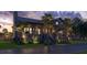 Elegant two-story home features a covered porch, stone accents, and professional landscaping at 27 Rebellion Rd, Charleston, SC 29407
