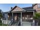 Charming exterior elevation showcasing the home's architectural detail, covered porch, and balcony at 27 Rebellion Rd, Charleston, SC 29407