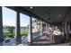 Inviting covered porch with comfortable seating, ceiling fans, and scenic backyard views at 27 Rebellion Rd, Charleston, SC 29407