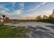 Cleared vacant lot showing location ideal for building your dream home with lush greenery in the background at 27 Rebellion Rd, Charleston, SC 29407